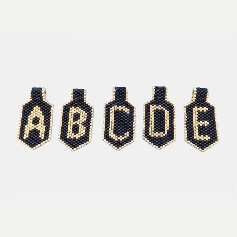 Pendentif avec lettre de l'alphabet