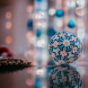 Geometric blue, cream, and gold Christmas ball.