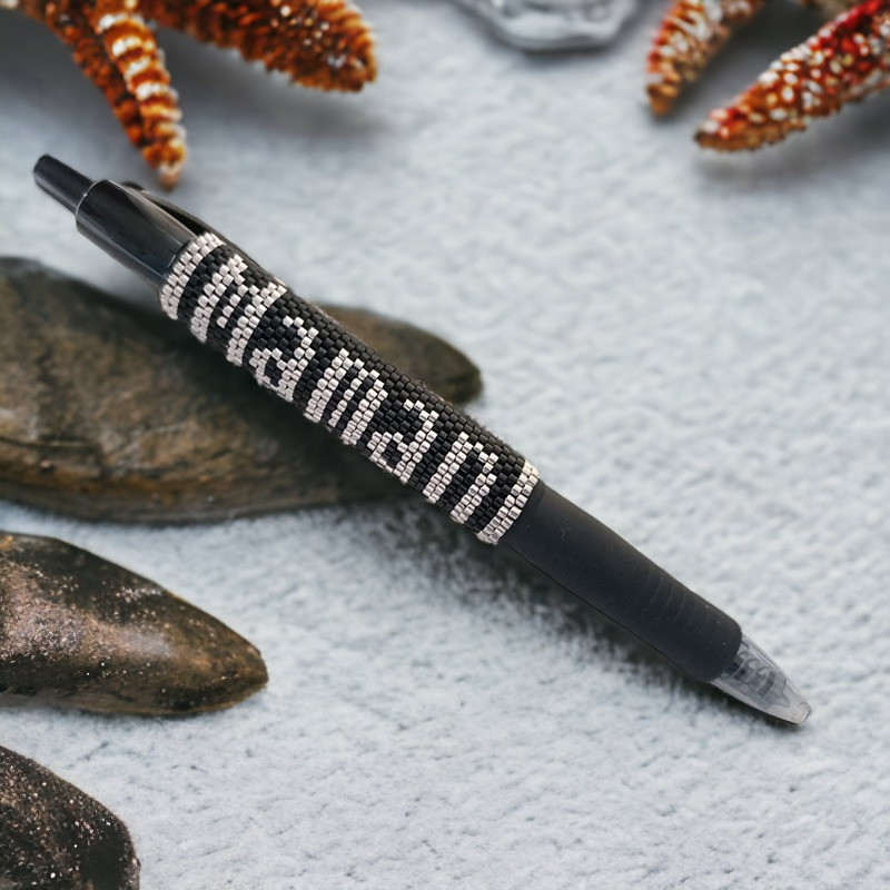 Ballpoint pen with “Maman” inscription.